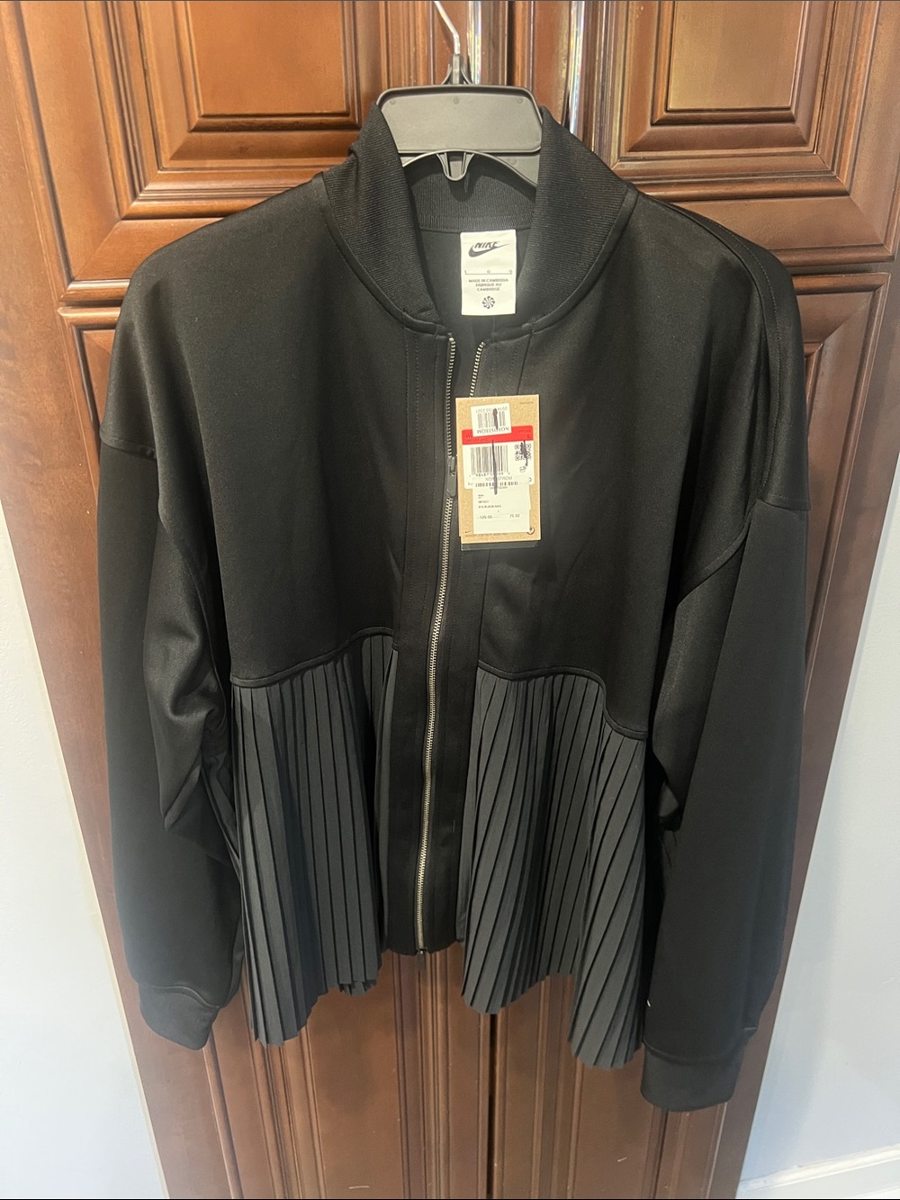 Nike Women's Black zip up Jacket with Pleated Hem